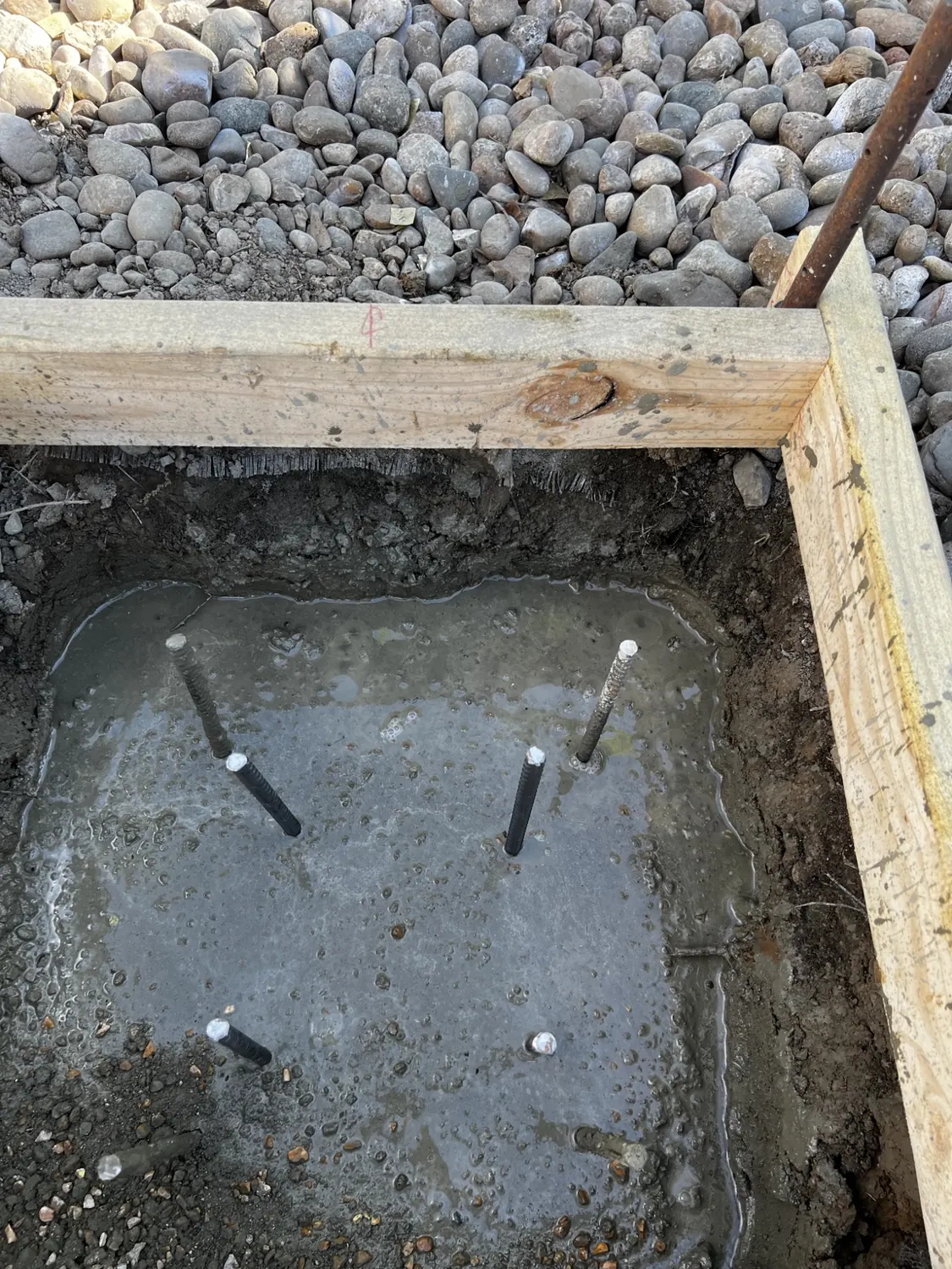 Footing excavated and anchor bolts set