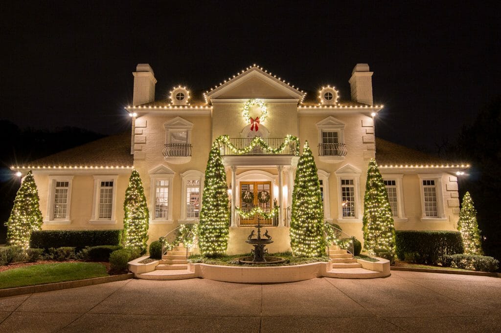 Warm-white roofline, shrub, and tree Christmas lighting