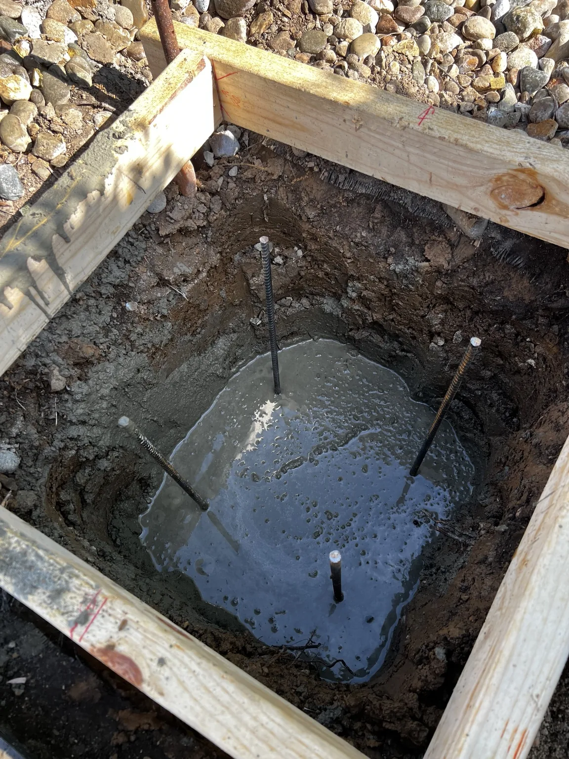 Concrete placed in the prepared basketball hoop footing