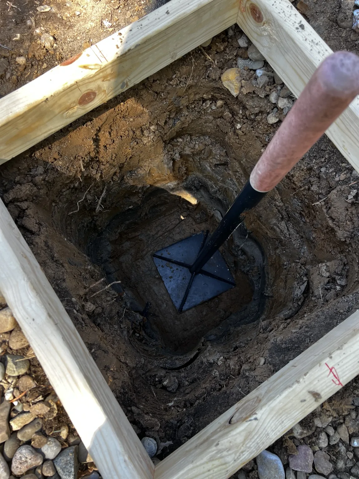 Excavated footing prepared below the square form