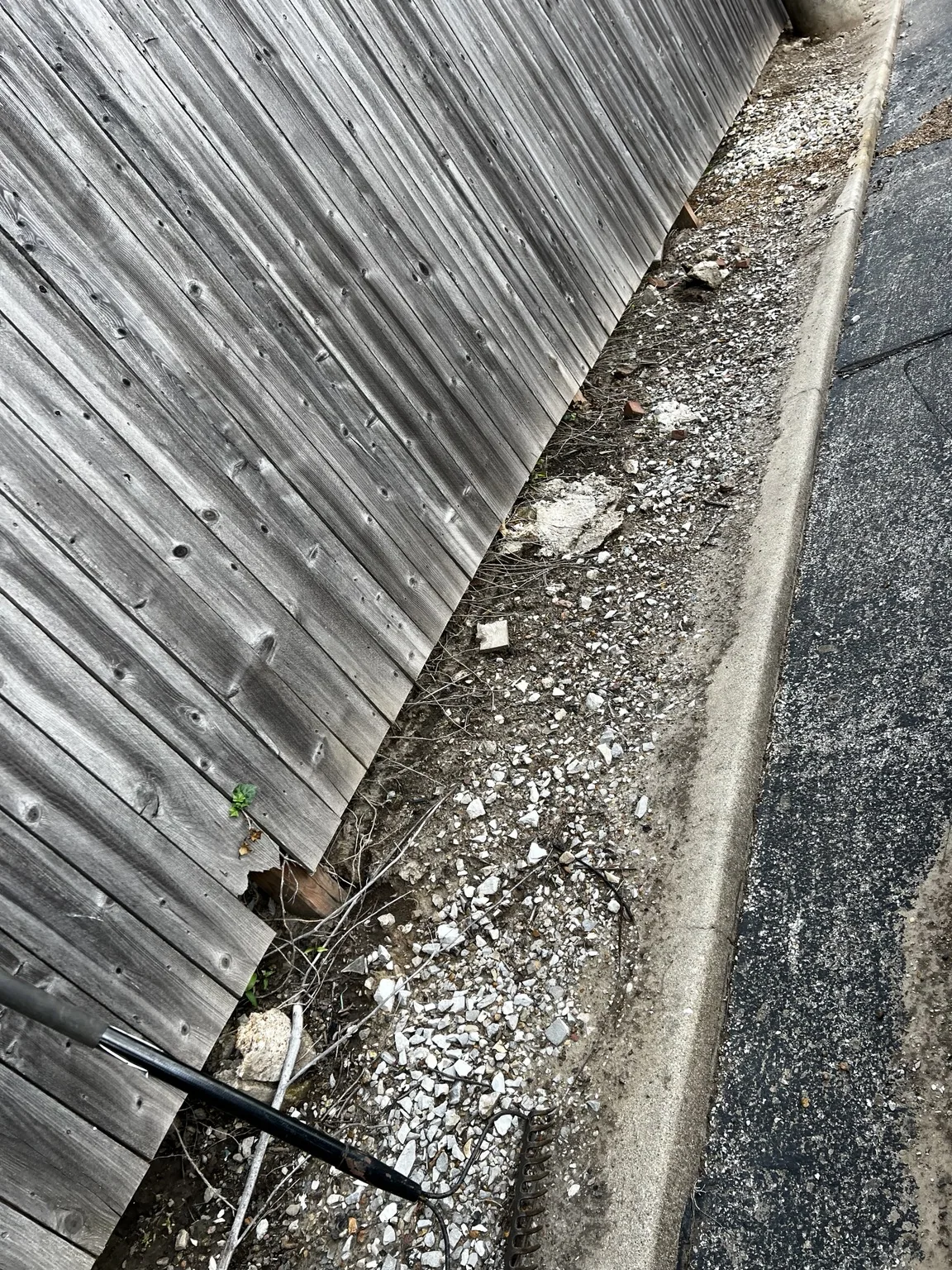 Rock and old material cleared from the fence line